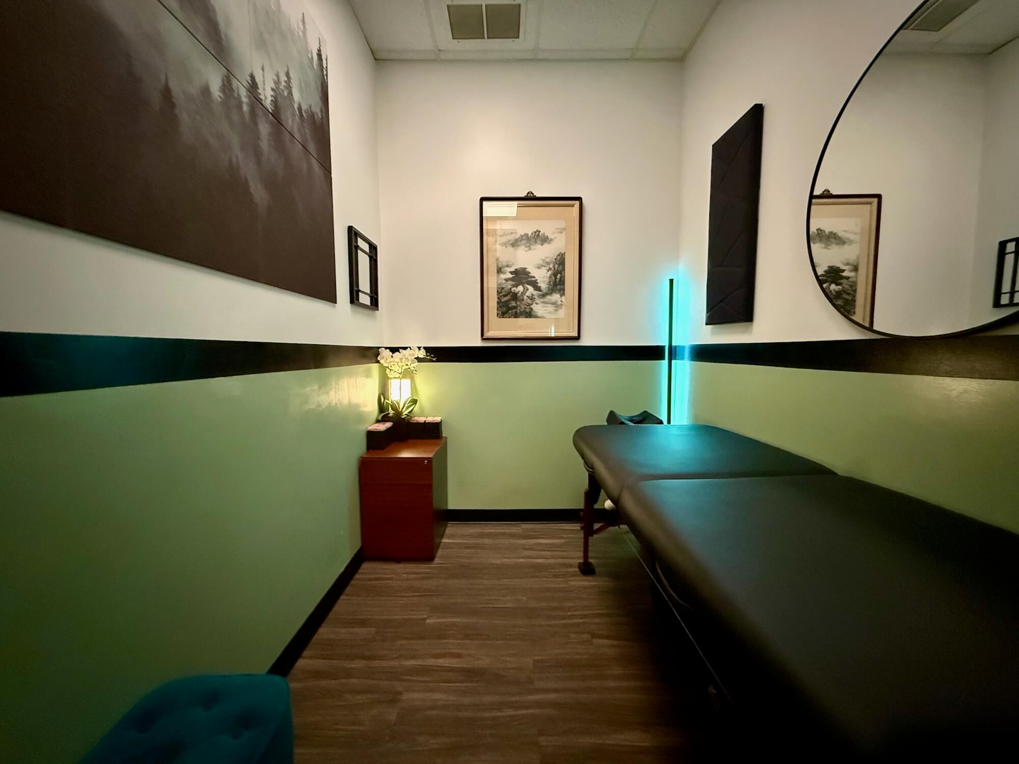 Treatment room with overhead lights on, used during assessment and needle placement